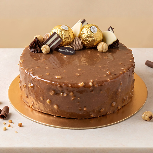 Ferrero Rocher Cake from Cakes and Bakes Bakery Dubai, a chocolate-hazelnut celebration cake decorated with Ferrero Rocher chocolates.