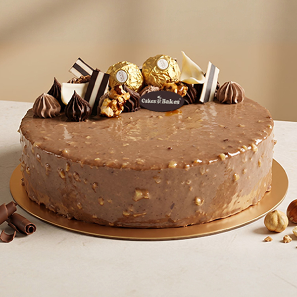 Ferrero Rocher Cake from Cakes and Bakes Bakery Dubai, a chocolate-hazelnut celebration cake decorated with Ferrero Rocher chocolates.