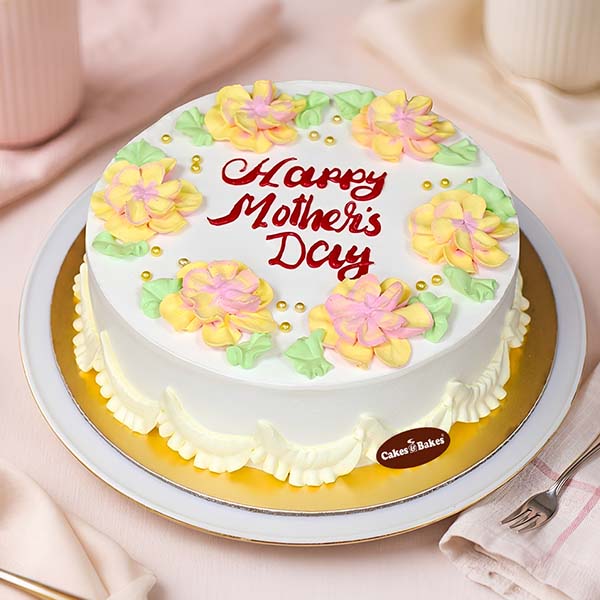 Floral Mothers Day Cream Cake with buttercream flowers by Cakes and Bakes Dubai