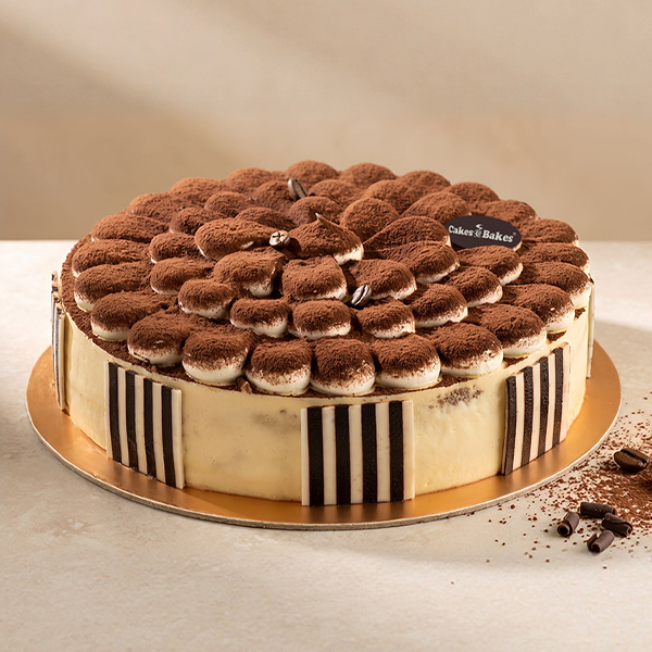 Classic Italian Tiramisu from Cakes and Bakes Bakery Dubai, a creamy coffee and cocoa-flavored Italian dessert for celebrations and coffee lovers.