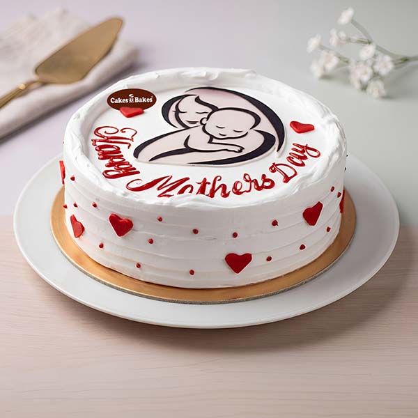 White cream Mother’s Day cake with mother and child edible print by Cakes and Bakes Dubai