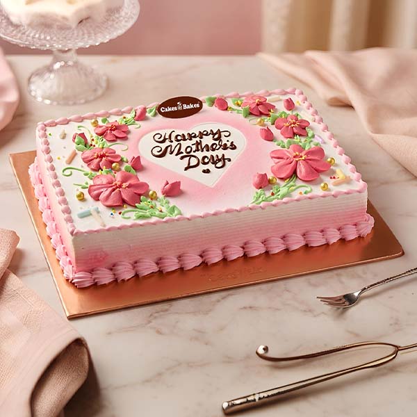 Mother Day Floral Cream Cake with pink floral icing by Cakes and Bakes Dubai