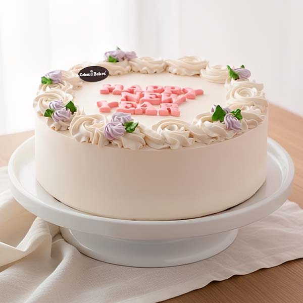 Elegant New Year Floral Cake – Soft Pastel Cream Finish