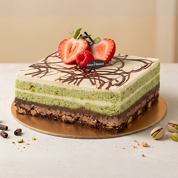 Pistachio Chocolate Cake from Cakes and Bakes Bakery Dubai featuring pistachio sponge, pistachio cream, rich chocolate ganache and a crunchy layer.